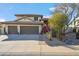 Charming home with a three-car garage, well-maintained landscaping, and desert accents at 19240 N 90Th Pl, Scottsdale, AZ 85255