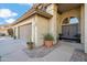 Inviting home featuring a three-car garage, tiled walkway, and well-manicured landscaping at 19240 N 90Th Pl, Scottsdale, AZ 85255