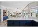 Spacious, open-concept kitchen with stone countertops, stainless steel appliances, and seamlessly integrates with the living area at 19240 N 90Th Pl, Scottsdale, AZ 85255