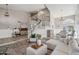 Spacious living room with high ceilings, wood flooring and a staircase at 19240 N 90Th Pl, Scottsdale, AZ 85255