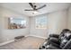Cozy media room with comfortable leather seating and a large screen TV at 19240 N 90Th Pl, Scottsdale, AZ 85255