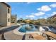 Beautiful backyard with a sparkling pool and lush landscaping at 19240 N 90Th Pl, Scottsdale, AZ 85255
