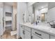 Elegant bathroom with a double sink vanity, white countertops and walk-in shower at 2030 E Michigan Ave # 9, Phoenix, AZ 85022