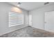 Bedroom featuring gray carpet, white walls, and a window with blinds at 2030 E Michigan Ave # 9, Phoenix, AZ 85022