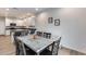 Dining area features a marble table, modern lighting, and an open concept to the kitchen at 2030 E Michigan Ave # 9, Phoenix, AZ 85022