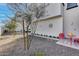 Modern townhome with xeriscaping, a small red table and chairs at 2030 E Michigan Ave # 9, Phoenix, AZ 85022