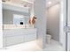 Bright bathroom featuring dual sinks, modern fixtures, and a separate toilet room and shower at 2055 W Windsor Ave, Phoenix, AZ 85009