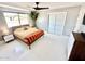 Bright bedroom featuring a unique ceiling fan, a large closet and minimalist décor at 2055 W Windsor Ave, Phoenix, AZ 85009