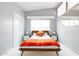 Bright bedroom featuring a cozy bed and matching modern mid-century modern nightstands with lamps at 2055 W Windsor Ave, Phoenix, AZ 85009