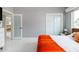 Bright bedroom with frosted glass closet doors and view into connecting room at 2055 W Windsor Ave, Phoenix, AZ 85009