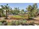 Encanto park featuring a playground, picnic tables, and lush green trees at 2055 W Windsor Ave, Phoenix, AZ 85009