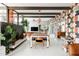 Stylish dining area with retro decor, modern furnishings, and an open-concept layout at 2055 W Windsor Ave, Phoenix, AZ 85009