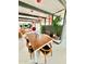 Dining area with a stylish wooden table and chairs, fireplace, and retro lighting at 2055 W Windsor Ave, Phoenix, AZ 85009