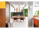 Contemporary dining area featuring a wooden table, stylish chairs, and retro accents at 2055 W Windsor Ave, Phoenix, AZ 85009