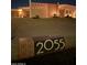 Contemporary address marker with plants and lighting leads up to modern home with unique architectural details at 2055 W Windsor Ave, Phoenix, AZ 85009