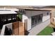 Modern home exterior with clean lines, a wood slat fence, and desert landscaping at 2055 W Windsor Ave, Phoenix, AZ 85009