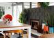 Modern fireplace with unique plants and pots, and view into dining area at 2055 W Windsor Ave, Phoenix, AZ 85009