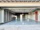 Spacious garage featuring ample storage with gray cabinets, epoxy flooring, and great overhead lighting at 2055 W Windsor Ave, Phoenix, AZ 85009