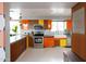 Well-lit kitchen with modern stainless steel appliances and plenty of cabinet space at 2055 W Windsor Ave, Phoenix, AZ 85009
