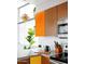Bright kitchen with stainless steel appliances, modern countertops, and colorful cabinetry at 2055 W Windsor Ave, Phoenix, AZ 85009