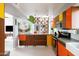 Spacious kitchen featuring modern appliances, a breakfast bar and colorful decor accents at 2055 W Windsor Ave, Phoenix, AZ 85009