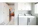 Convenient laundry room with modern washer and dryer units and ample storage space at 2055 W Windsor Ave, Phoenix, AZ 85009