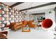 Living area features stylish furniture, a retro wall design, and a large mirror at 2055 W Windsor Ave, Phoenix, AZ 85009