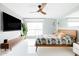 Stylish main bedroom with modern decor, a ceiling fan and decorative plants at 2055 W Windsor Ave, Phoenix, AZ 85009