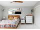Bright main bedroom featuring stylish decor, a large mirror, and comfortable furnishings at 2055 W Windsor Ave, Phoenix, AZ 85009