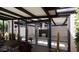 Outdoor patio showcasing a modern fireplace viewed through large glass windows at 2055 W Windsor Ave, Phoenix, AZ 85009