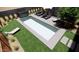 Backyard with a rectangular pool, lounge chairs, and green landscaping at 2055 W Windsor Ave, Phoenix, AZ 85009
