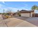 Well-maintained single-story home with brick facade, two-car garage, and mature landscaping at 2447 E La Jolla Dr, Tempe, AZ 85282
