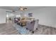 Comfortable living room with neutral tones, tile floors, and a view into the kitchen and dining area at 2447 E La Jolla Dr, Tempe, AZ 85282