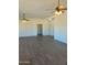 Living room showcasing ceiling fans and tile floors at 24836 W Montgomery W Rd, Wittmann, AZ 85361