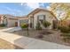 Beautiful single-level home with desert landscaping, two-car garage, and a cozy covered entry at 25610 N 144Th Ln, Surprise, AZ 85387