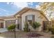 Charming single-story house featuring desert landscaping, a two-car garage, and covered front porch at 25610 N 144Th Ln, Surprise, AZ 85387