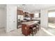 Modern kitchen featuring a large island with seating, stainless steel appliances, and access to the patio at 25610 N 144Th Ln, Surprise, AZ 85387