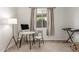 Cozy office with natural light, carpet floors, a modern desk, and a musical keyboard at 25610 N 144Th Ln, Surprise, AZ 85387