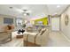 Bright living room featuring an open layout, modern furnishings, and a view into the kitchen at 2631 E Jones Ave, Phoenix, AZ 85040