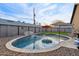 Sparkling backyard pool featuring a waterfall feature, and a neatly landscaped area at 2631 E Jones Ave, Phoenix, AZ 85040