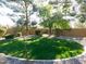 Lush green lawn with mature trees and shrubs at 265 E Liberty Ln, Gilbert, AZ 85296
