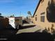 Spacious backyard with desert landscaping and block wall fence for low-maintenance outdoor living at 265 E Liberty Ln, Gilbert, AZ 85296