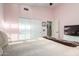 Cozy bedroom with pink walls, closet and doorway to the en-suite at 265 E Liberty Ln, Gilbert, AZ 85296