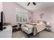 Comfortable bedroom with carpet flooring, shutters, ceiling fan, and pastel walls at 265 E Liberty Ln, Gilbert, AZ 85296