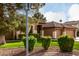 Landscaped front yard showcasing vibrant greenery and curb appeal of the lovely home at 265 E Liberty Ln, Gilbert, AZ 85296