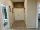 Hallway with tile flooring and decorative wall art at 265 E Liberty Ln, Gilbert, AZ 85296