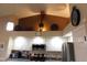 Modern kitchen with stainless steel appliances, white cabinets, and stylish decor at 265 E Liberty Ln, Gilbert, AZ 85296