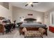 Spacious main bedroom with a large bed, vaulted ceilings, and a cozy seating area at 265 E Liberty Ln, Gilbert, AZ 85296