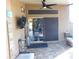 Covered patio featuring a ceiling fan and mounted television for relaxed outdoor entertainment at 265 E Liberty Ln, Gilbert, AZ 85296