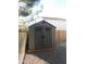 Durable resin shed with double doors, perfect for additional storage of yard and garden supplies at 265 E Liberty Ln, Gilbert, AZ 85296